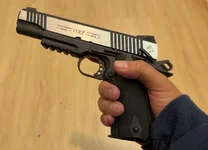Colt 1911 rail gun.webp