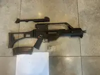 We G36C GBBR with engraved trades, carry handle optic and 1x mag